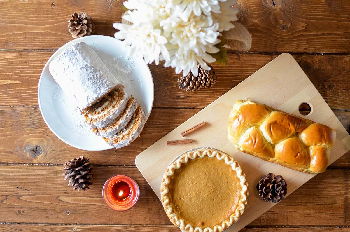 fall cake pie beside pine cones thanksgiving