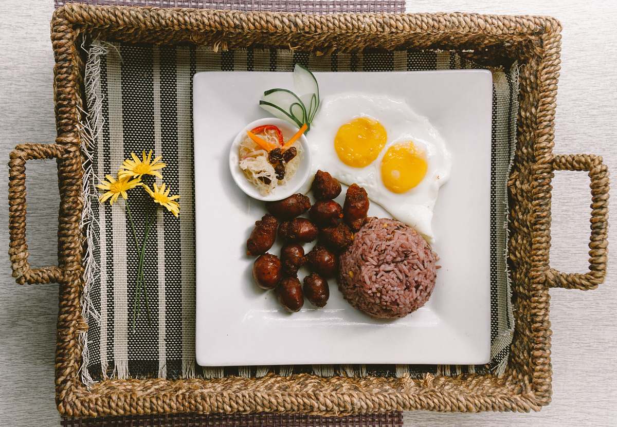 meal plate of foods on brown wicker tray breakfast