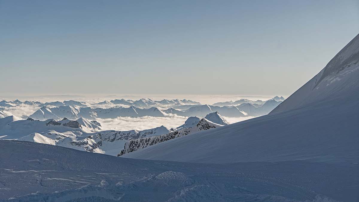 mountain clouds under mountain alps snow