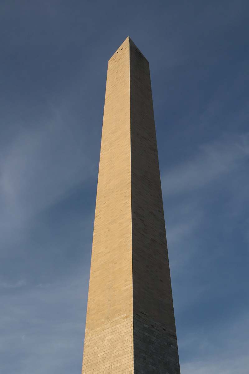 building grey stone prism tower at daytime architecture