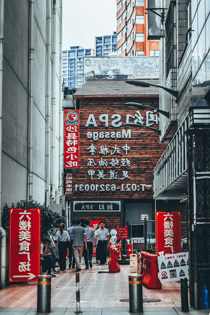china group of people standing on spa facade city