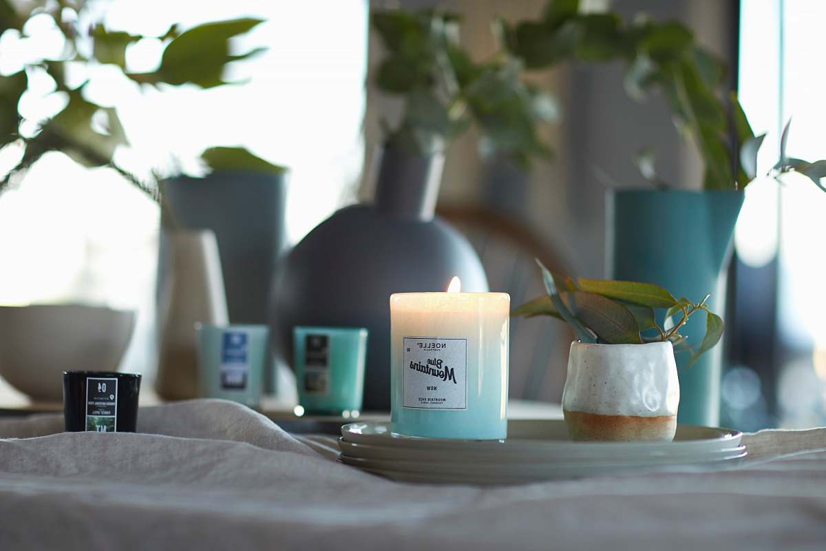 cup glass candle holder on ceramic plate blue mountains