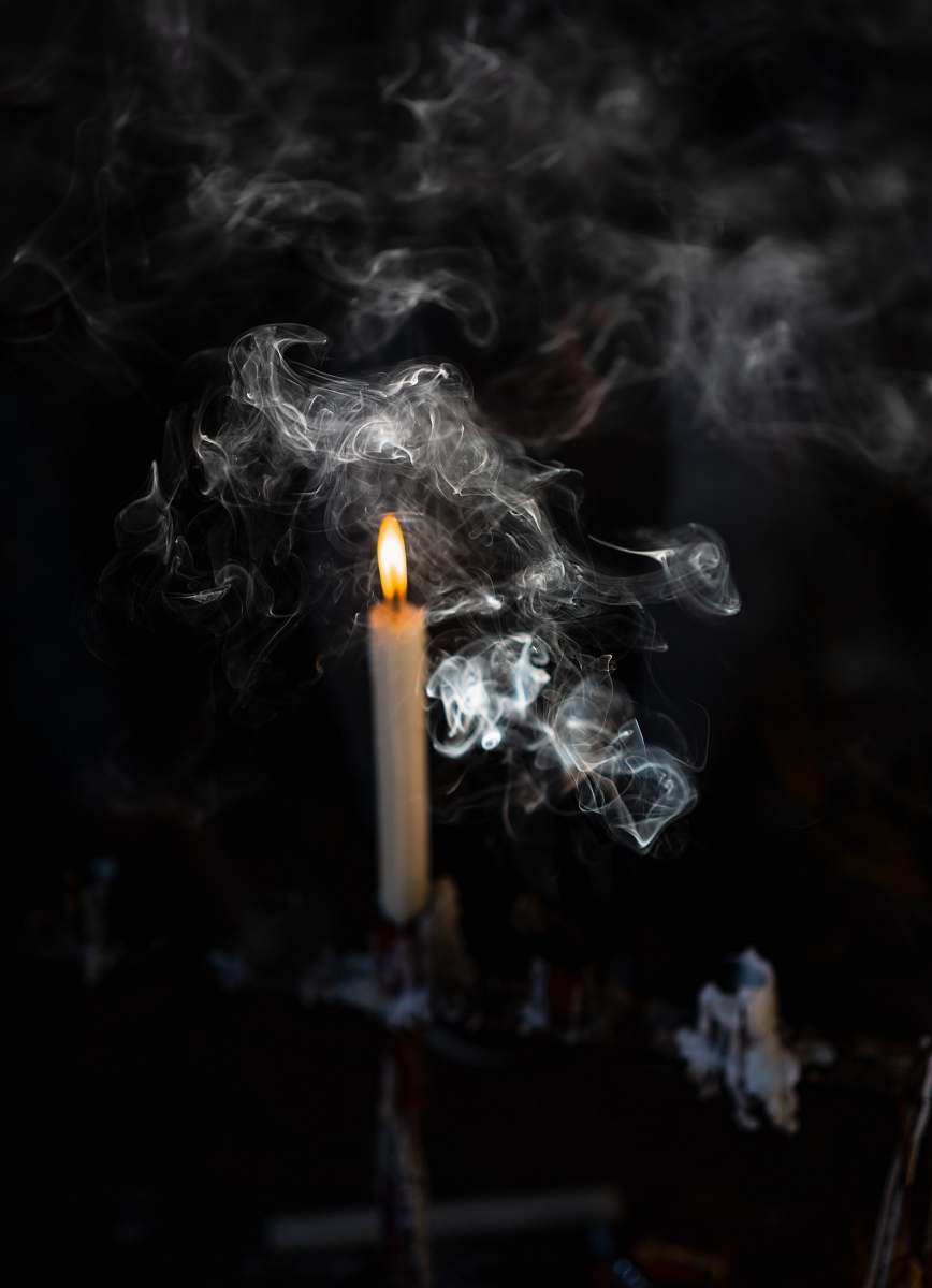 smoke lighted candle on candlestick cape town