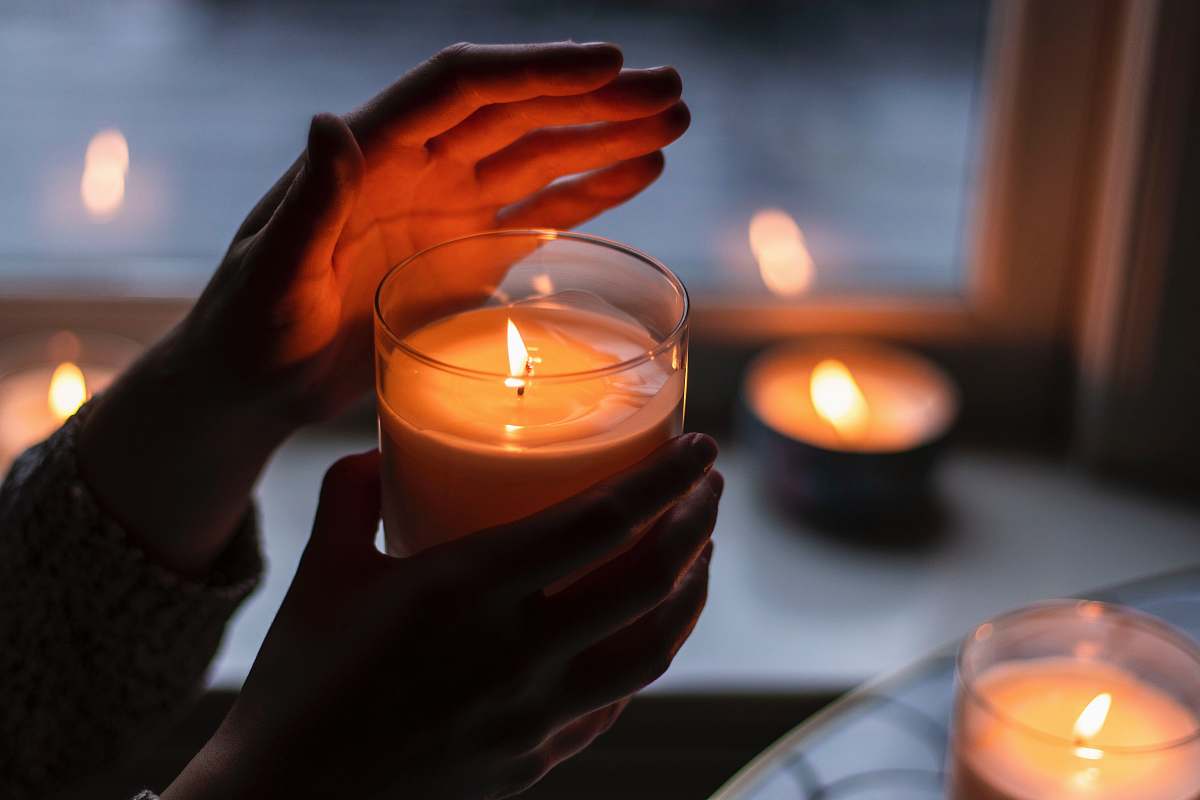 human lighted candles person