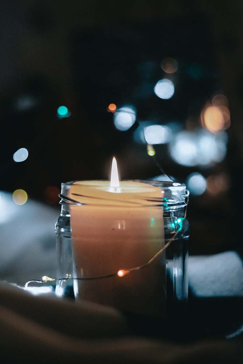 flame lighter white pillar candle inside glass jar fire