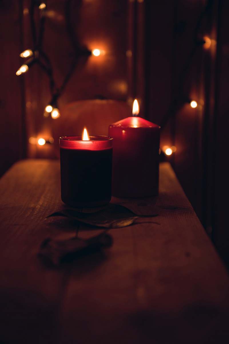 flame macro shot photography of two votive candles fire