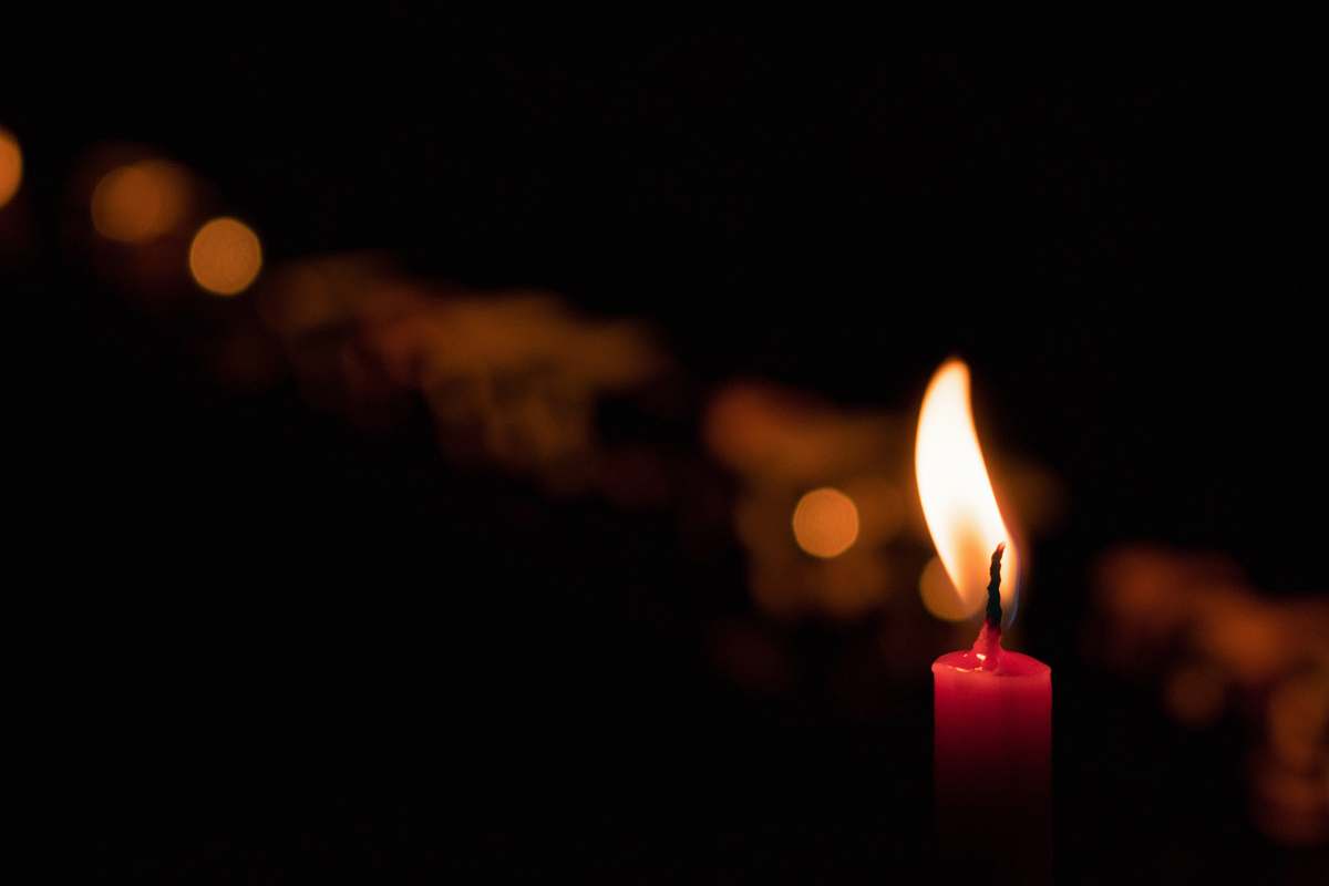 fire selective focus photography of red candle flame