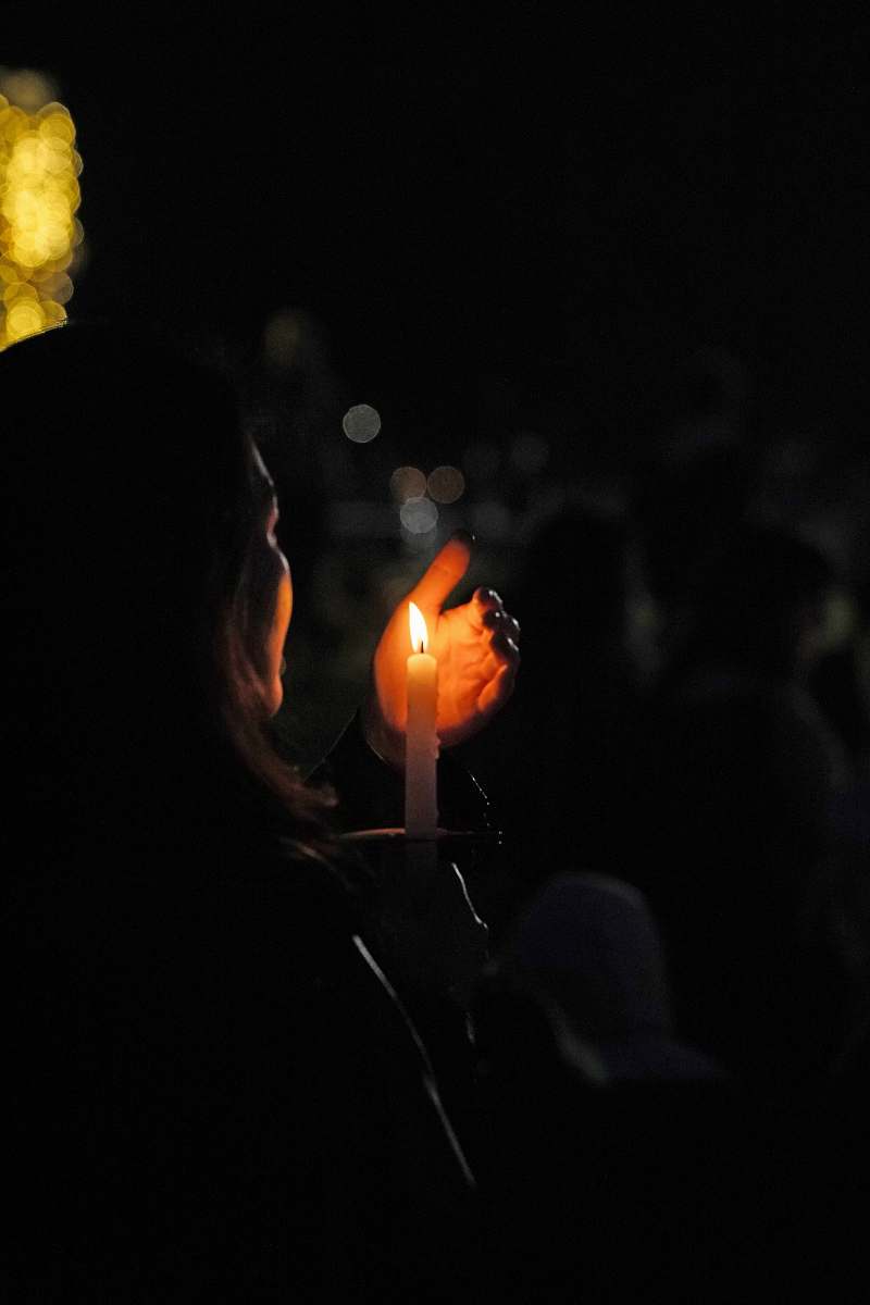 fire woman holding lit candle human