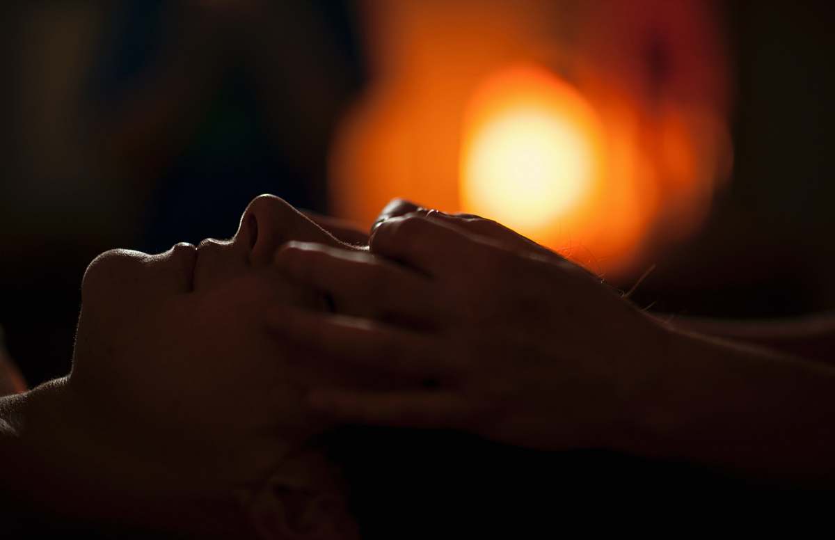  persons hand on top of sun 