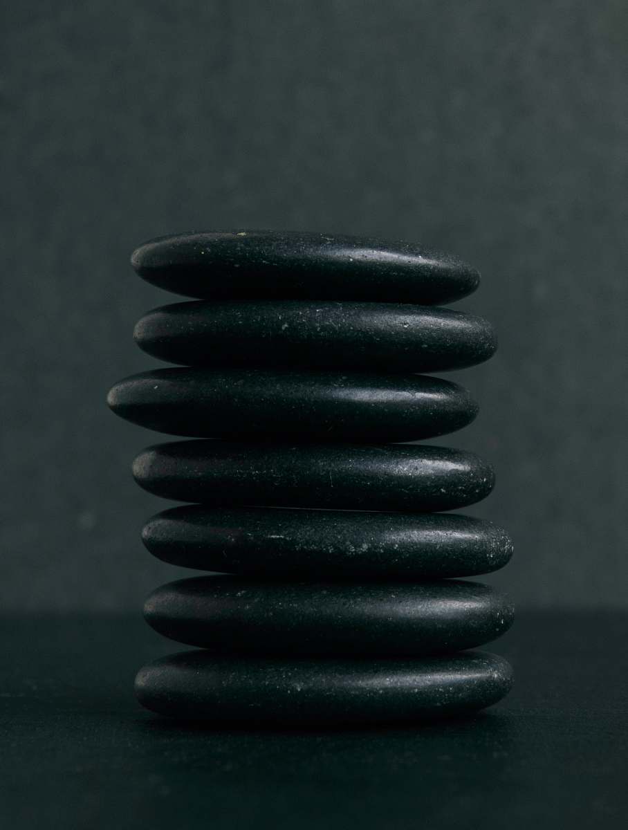 spiral selective focus photography of seven stacked stones coil