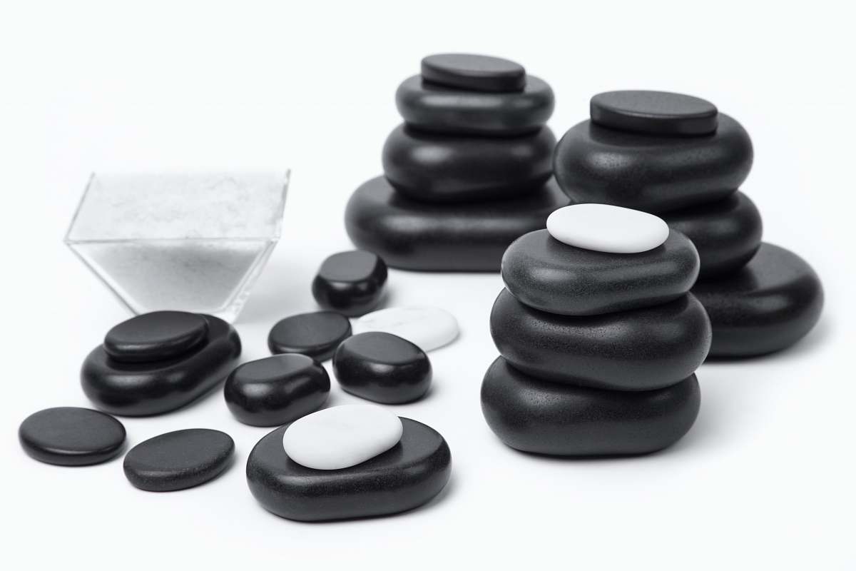 game black and gray stones on white surface pebble