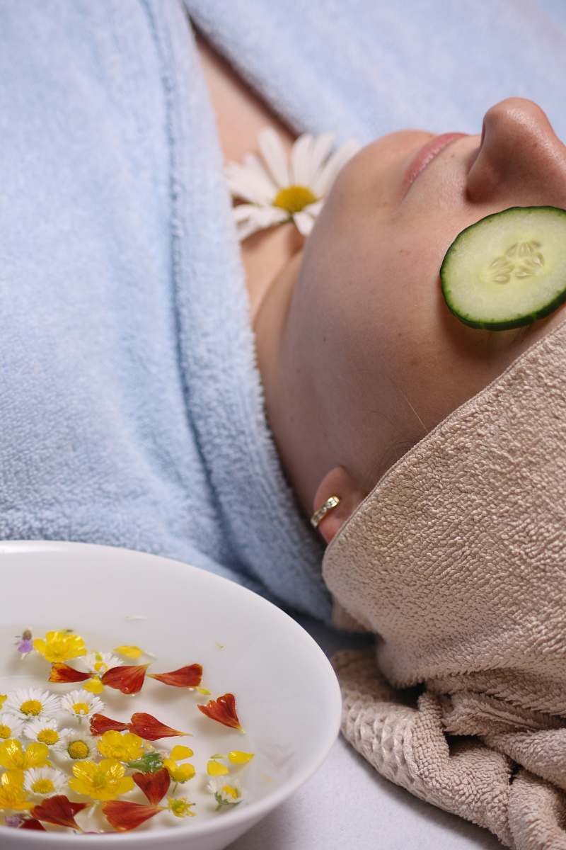 person person lying down on white surface cucumber