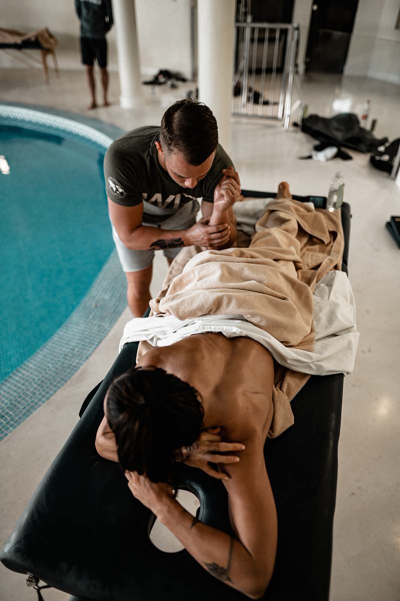 Experience the soothing ambiance of a serene indoor spa as a man indulges in a rejuvenating massage. This tranquil scene captures the essence of relaxation and wellness, perfect for promoting spa services, wellness retreats, and self-care products. Ideal for health and wellness content, advertising, and lifestyle blogs.