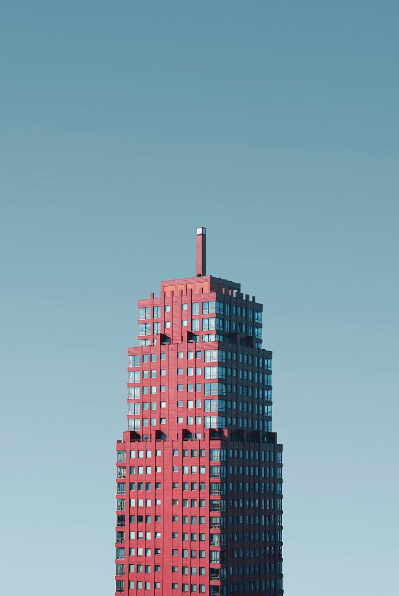aerial photography of red and glass building