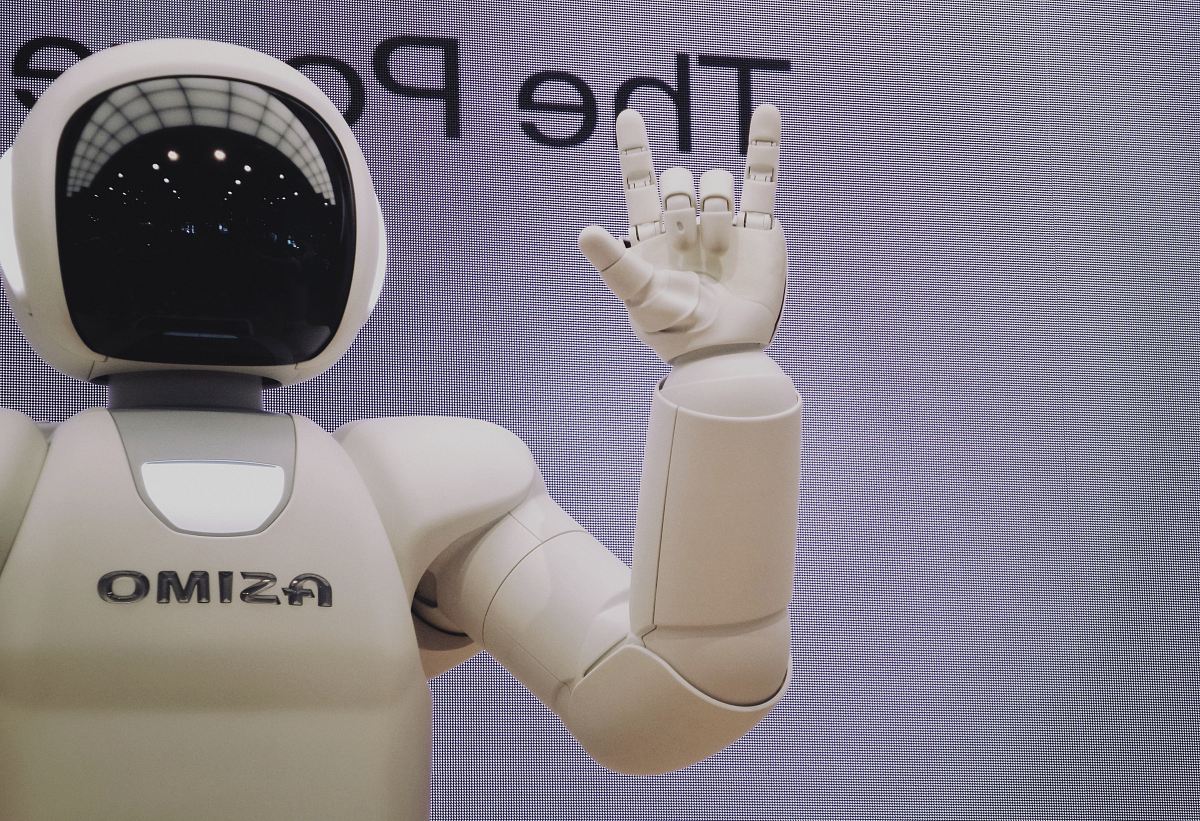 Asimo robot doing handsign