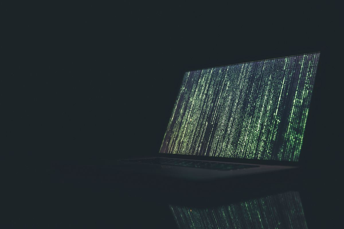 black and gray laptop computer turned on