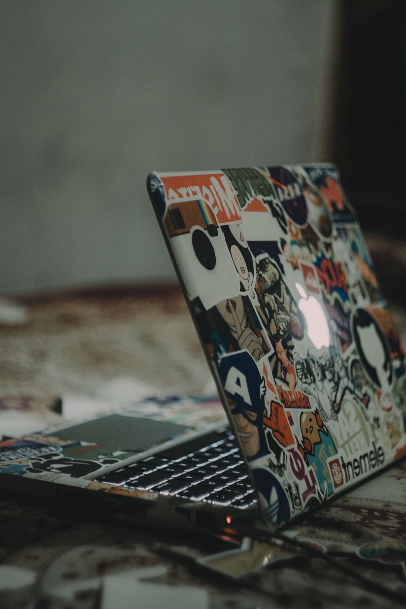 black and white laptop on floor