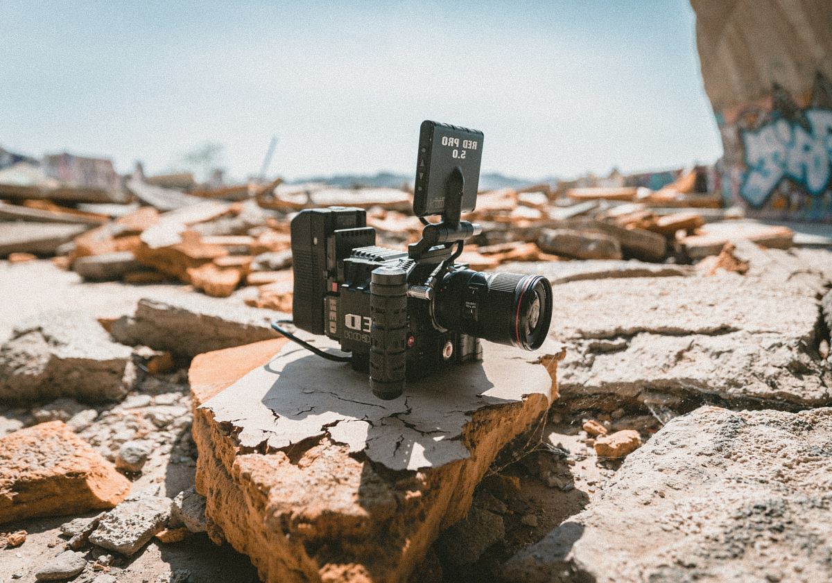 black camera on gray and brown stone