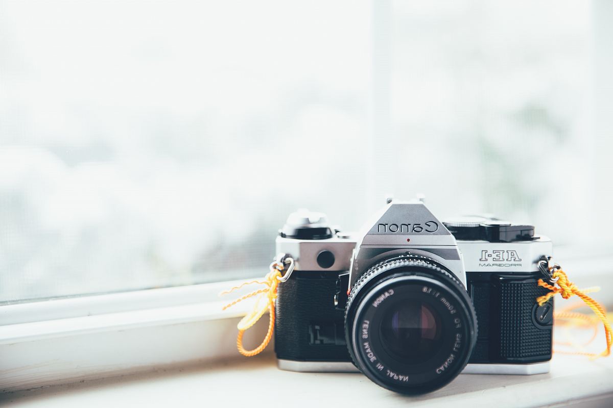Canon SLR camera on window