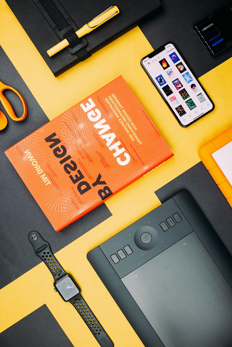 Change by Design by Tim Brown book beside smartphone