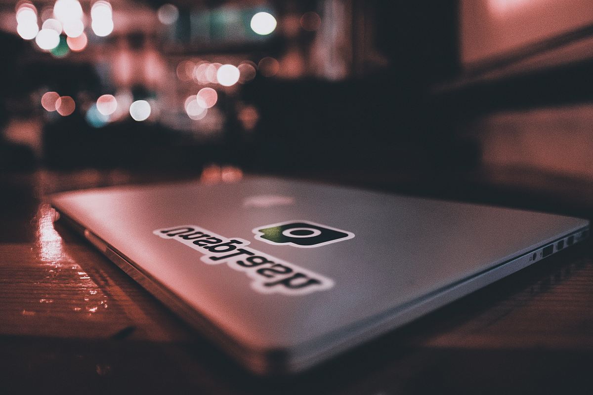 closed laptop computer on wooden surface