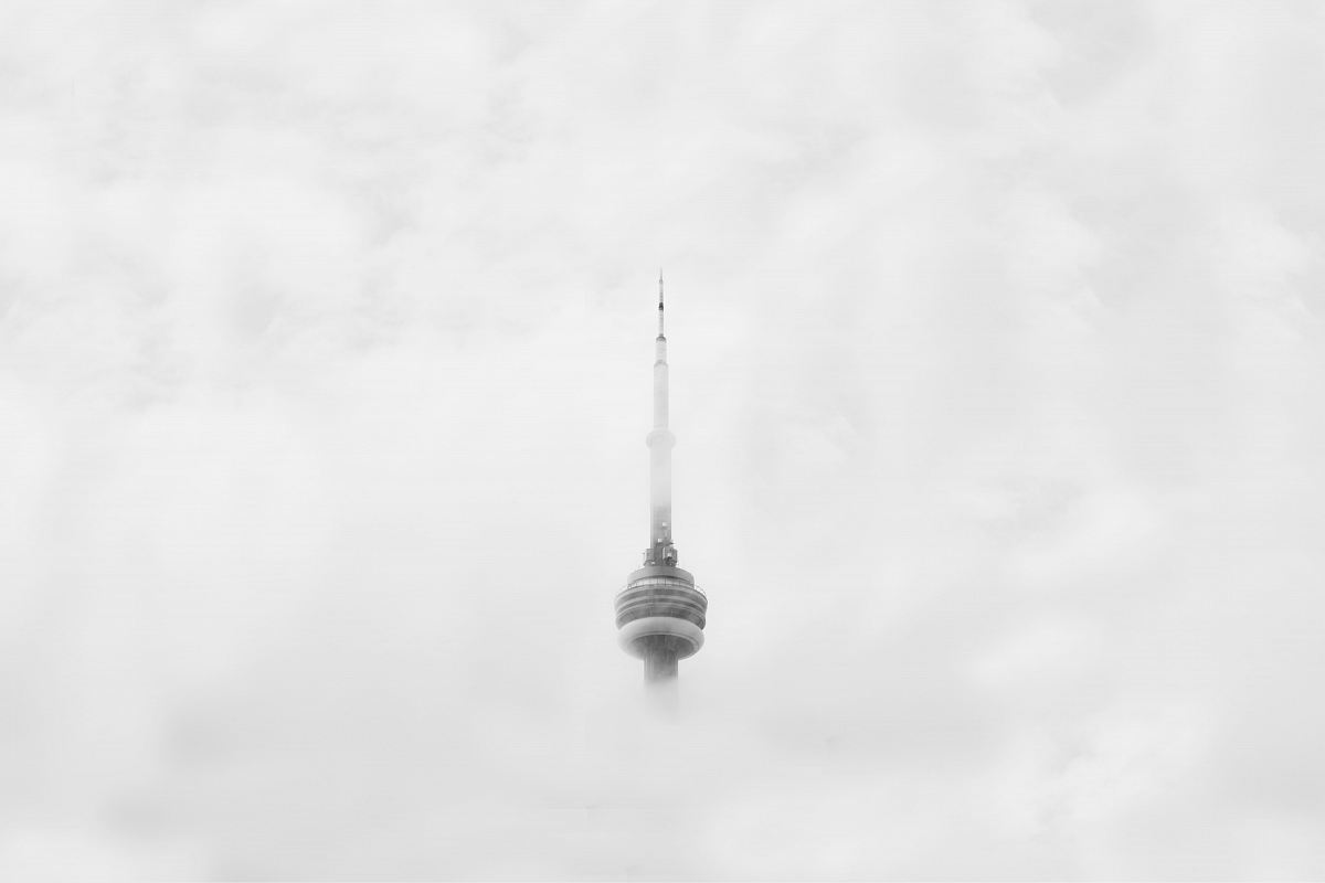 CNN Tower in Canada surrounded by clouds
