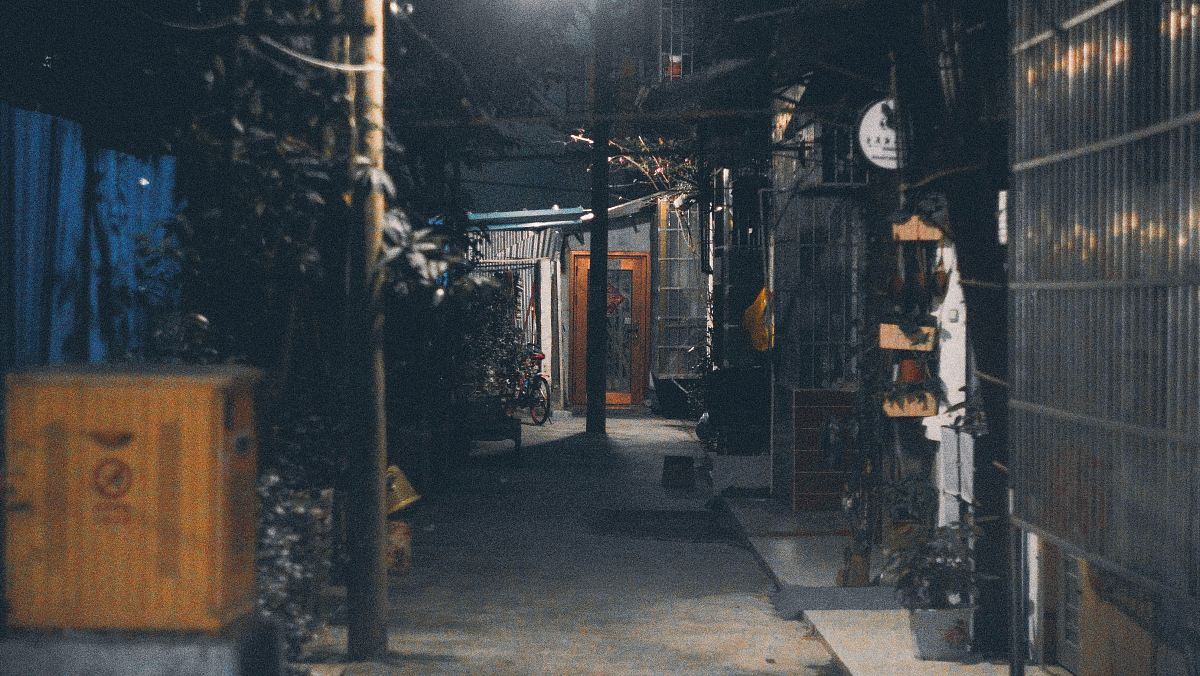 concrete pathway beside buildings