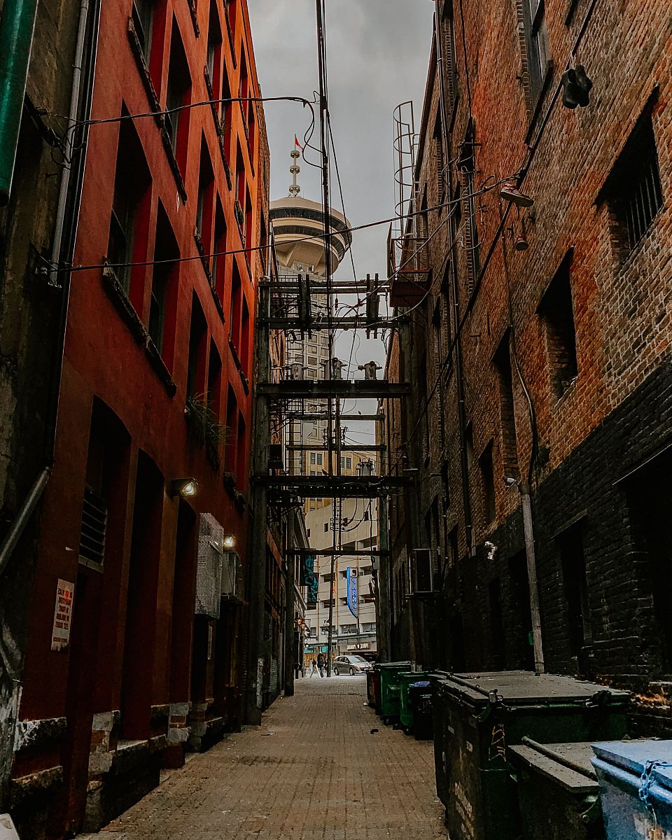 concrete pathway in between buildings