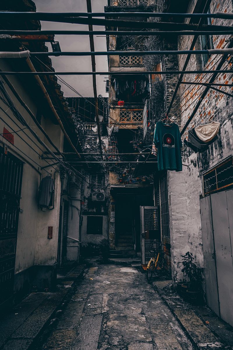 concrete pathway in between houses