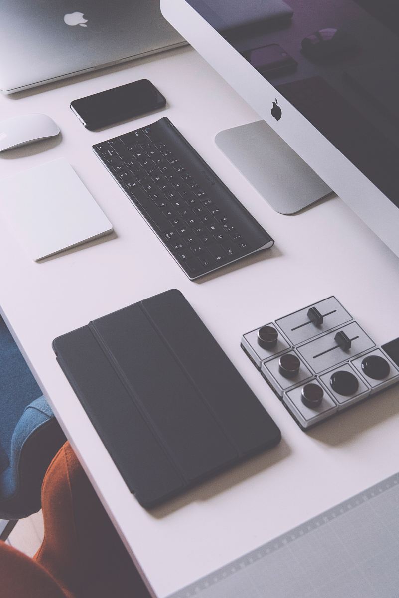 flat lay photography of black iPad case, Apple wireless keyboard, iMac on white table