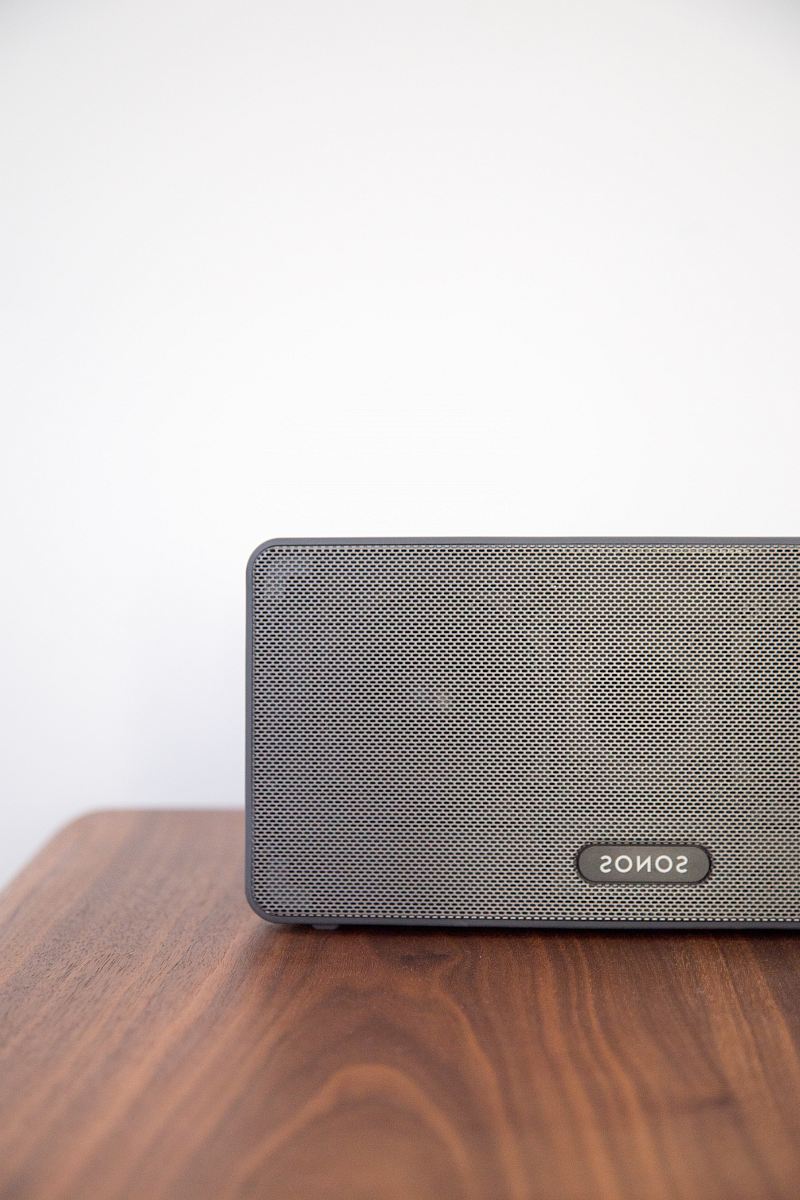 gray Sonos speaker on table