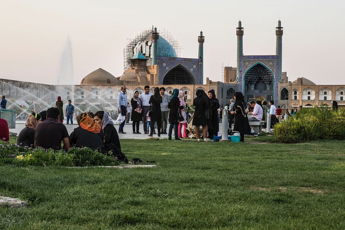group of people near the outdoor fountain