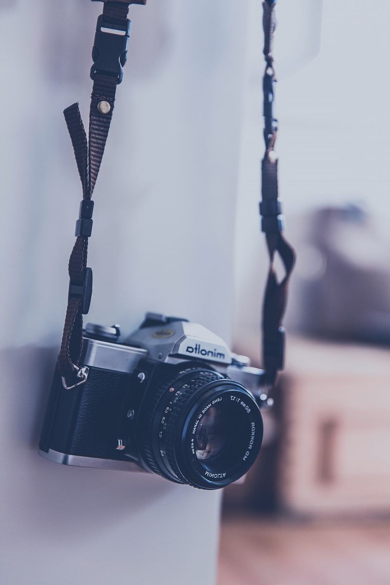 hanging black and grey camera
