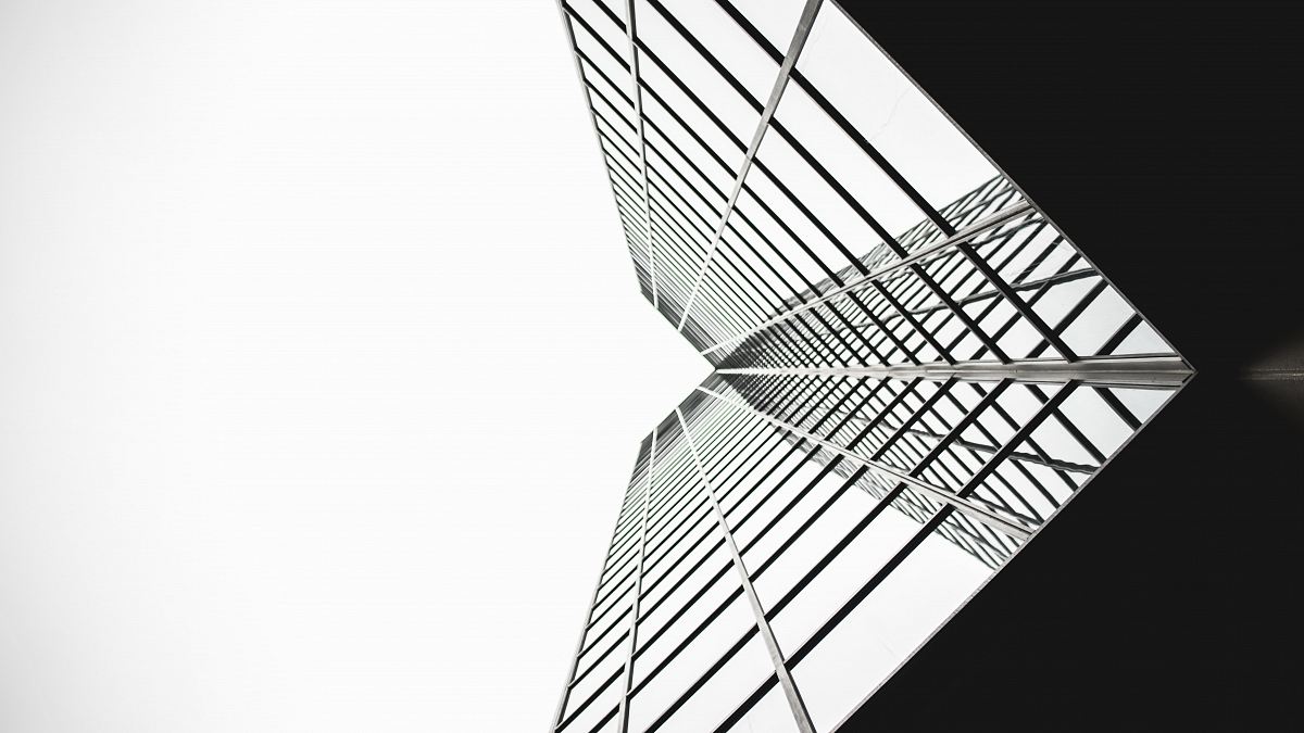 low angle photo of mirror glass building