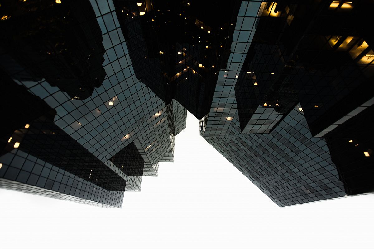 low-angle photography of building during daytime grayscale photography