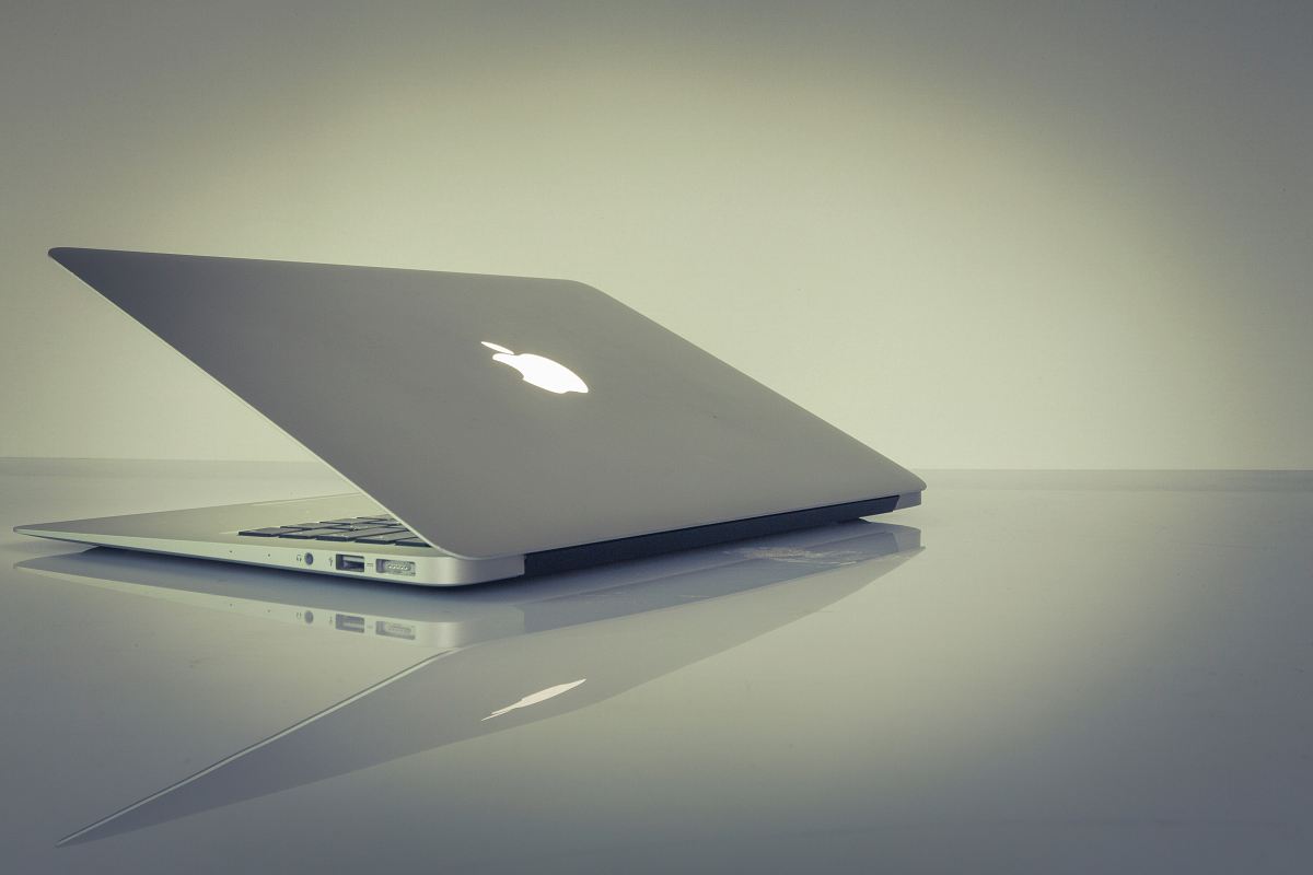 MacBook Air on top of white table
