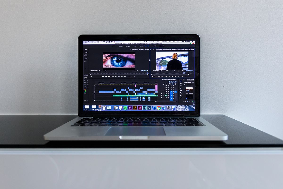 MacBook Pro on black desk