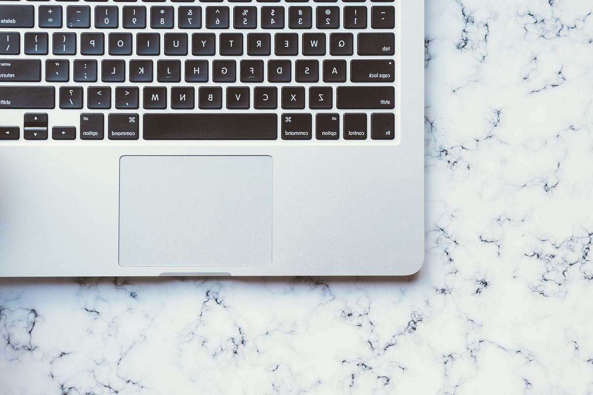 MacBook Pro on white marble surface