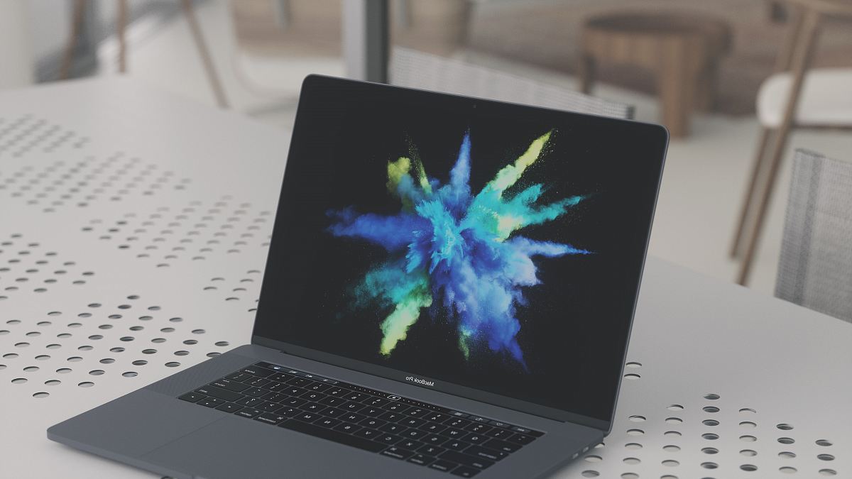 MacBook Pro on white metal surface