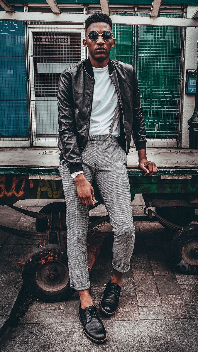 man in black jacket posing