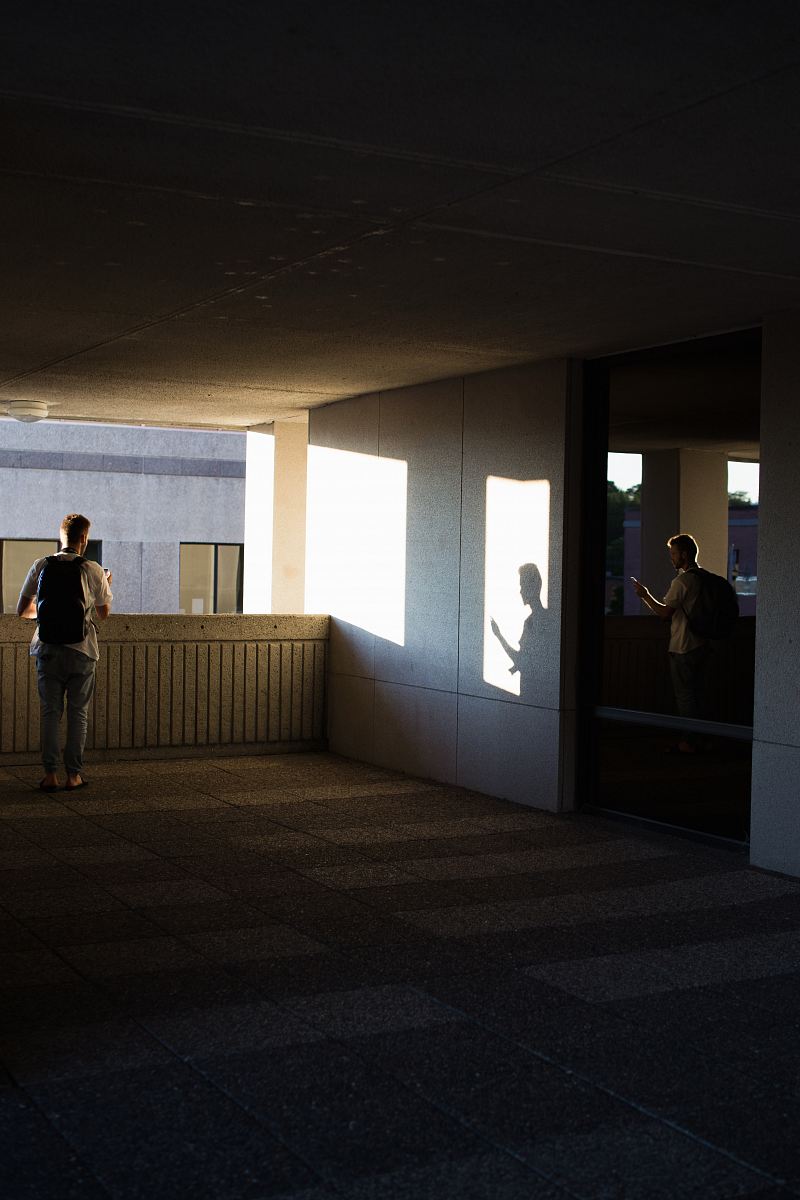 man standing on concrete flooring