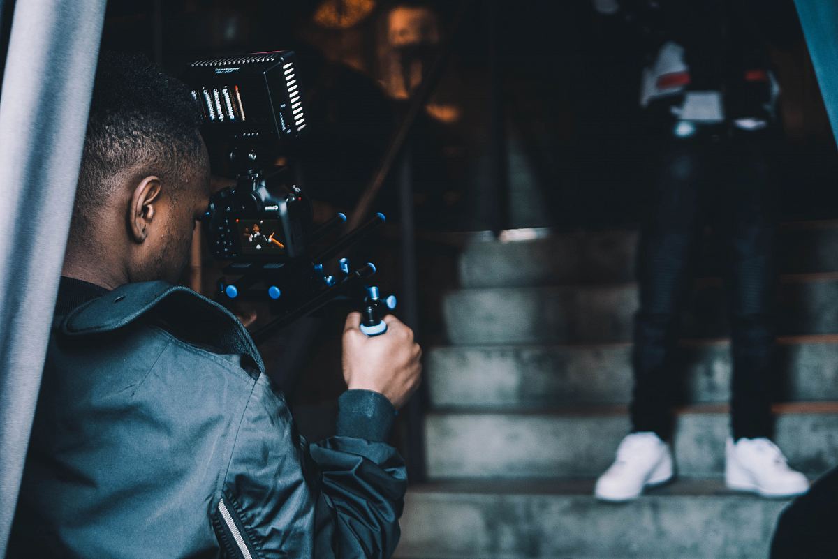 man taking photo of another man