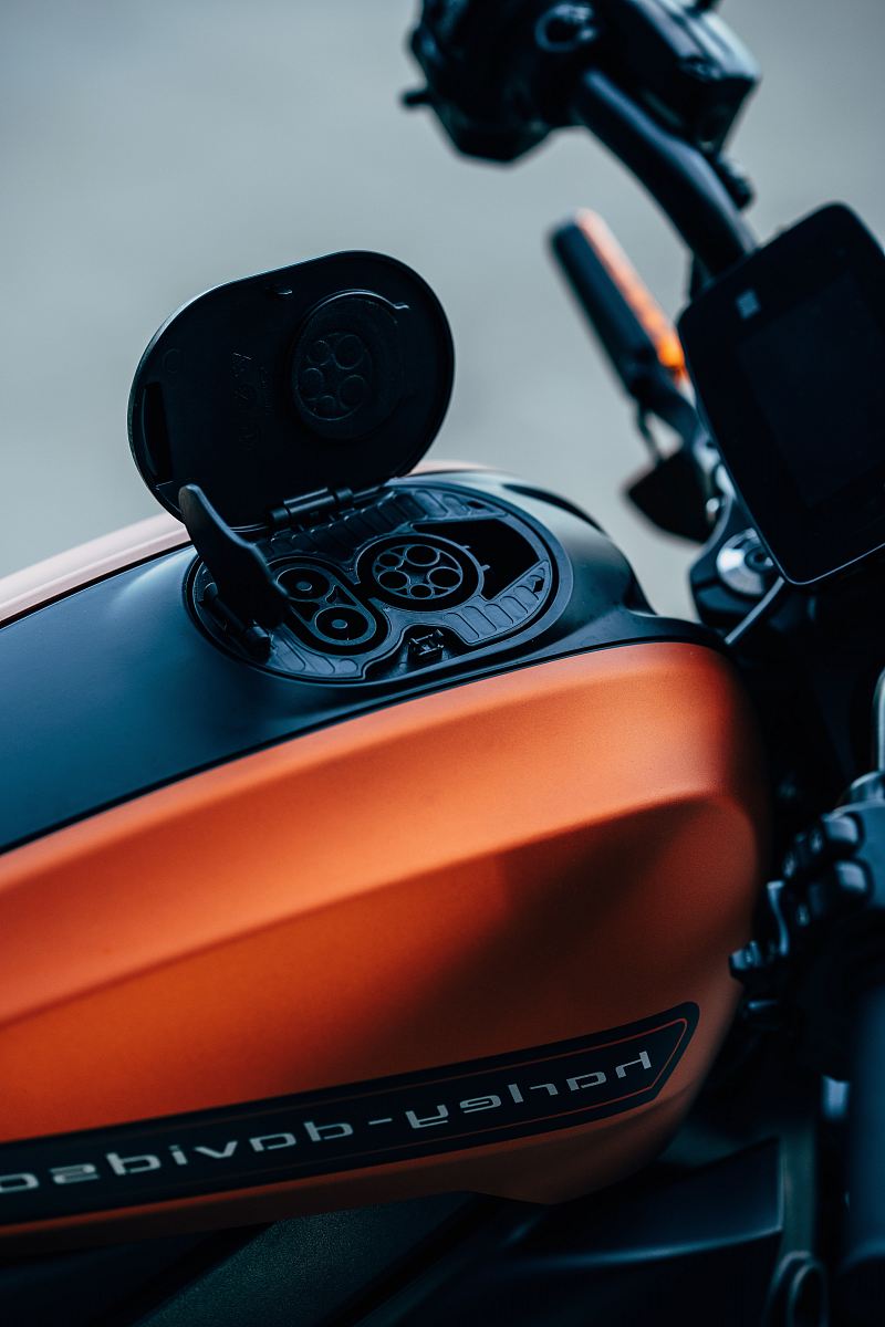 orange and black Harley-Davidson motorcycle