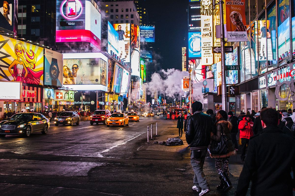 people walking beside buildings