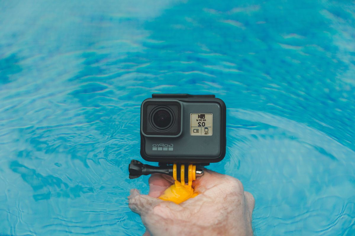 person holding GoPro HERO