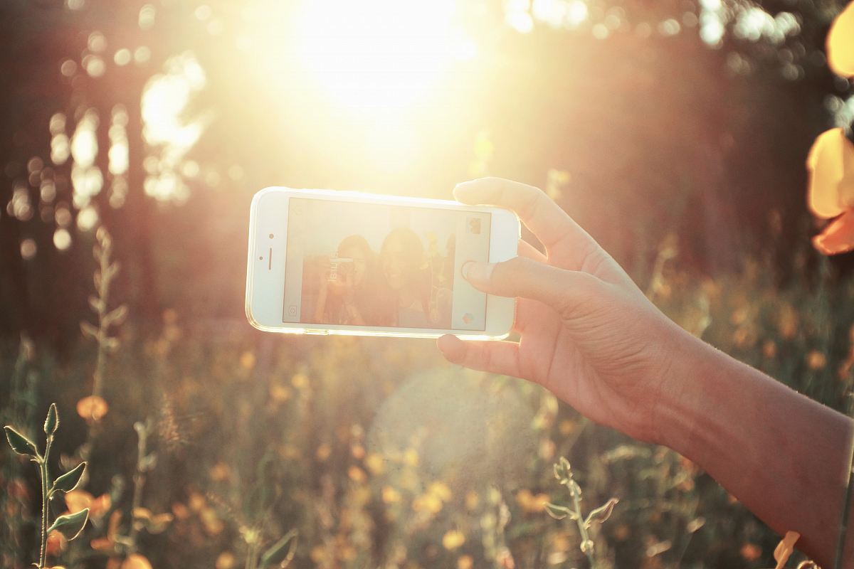 person holding white smartphone