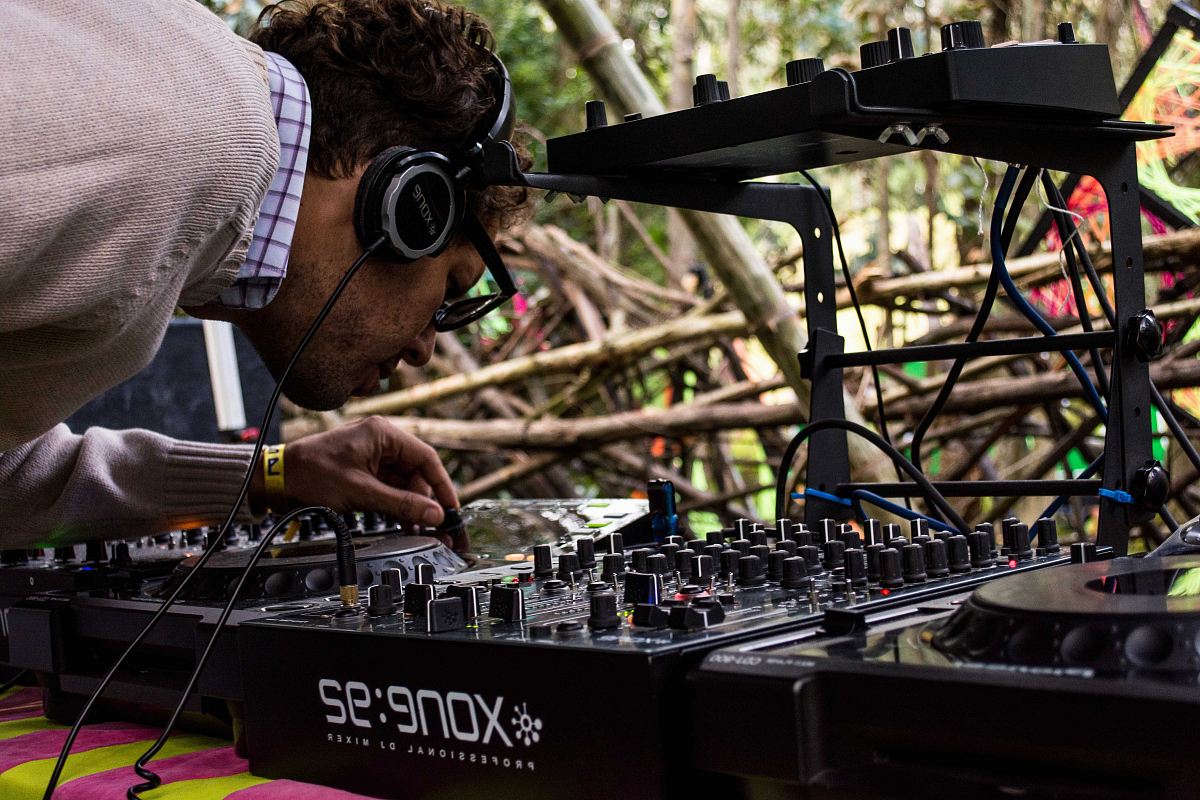 person operating DJ controller