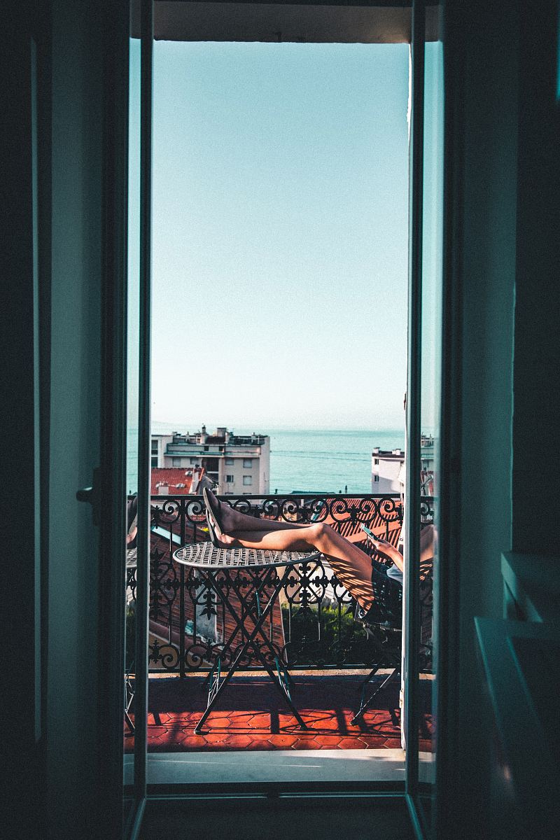 person sitting on balcony
