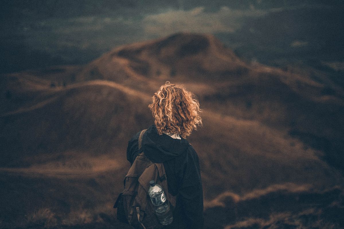 person standing on mountain