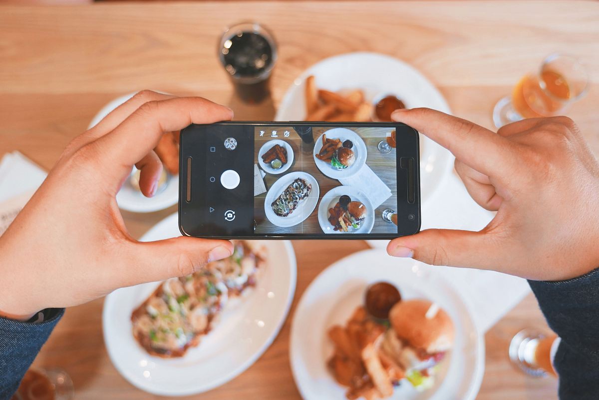 Person Taking Picture Of The Foods Image Free Photo